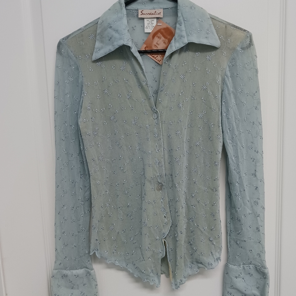 Brand new, beautiful light blue blouse by Surrealist. Size Medium